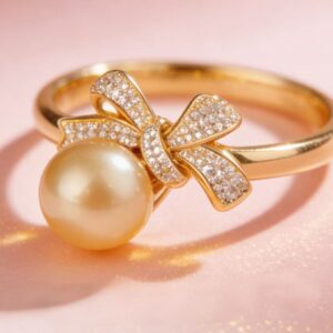 Deep golden pearl bow ring front product image